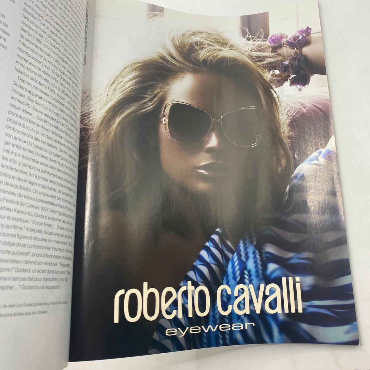 Ad page from Numéro Magazine May 2010 No. 113 featuring Roberto Cavalli eyewear with a model in stylish sunglasses, reflecting the luxurious fashion trends of the time.
