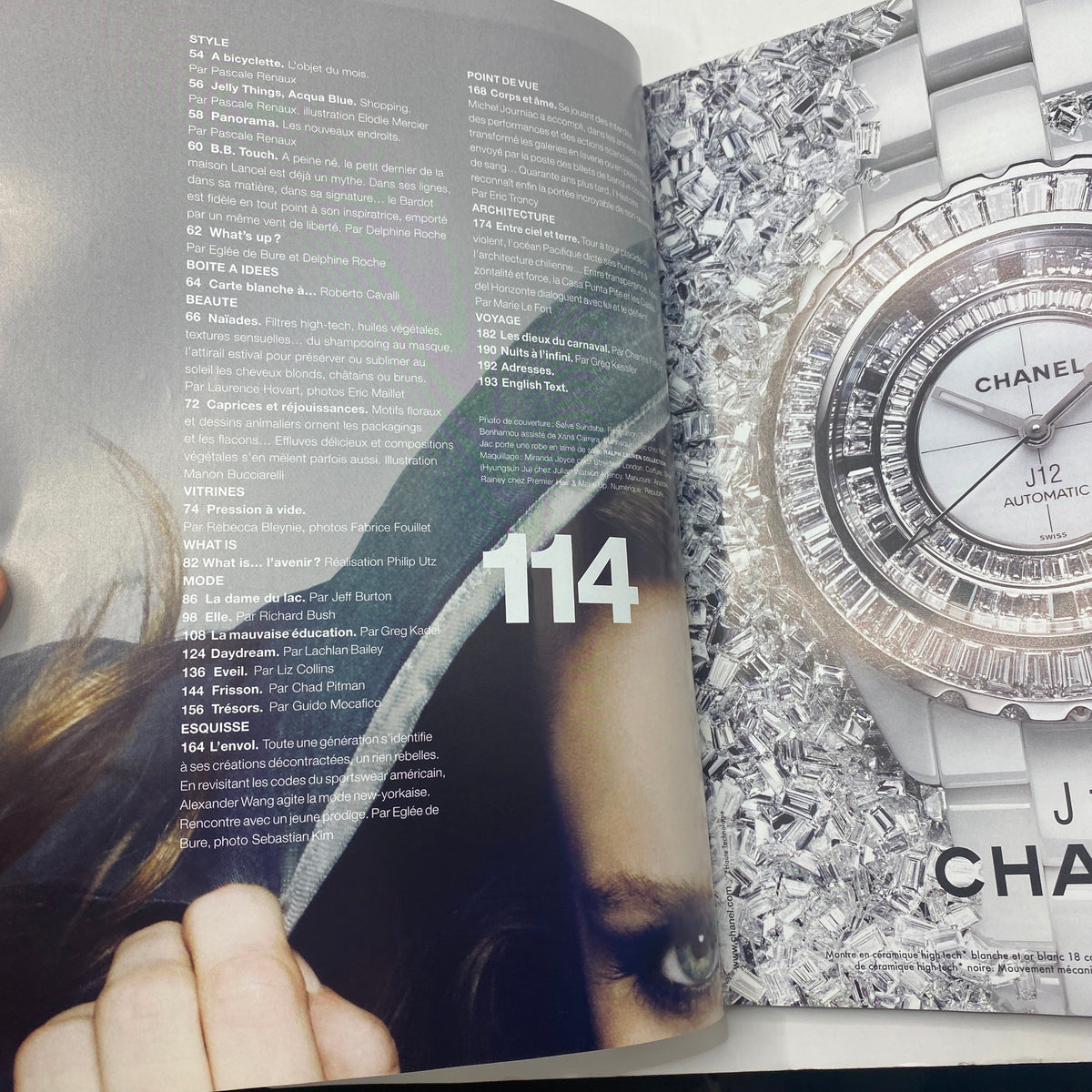 Inside page of Numéro Magazine July 2010 No. 114, displaying the table of contents with featured articles and stunning visuals.