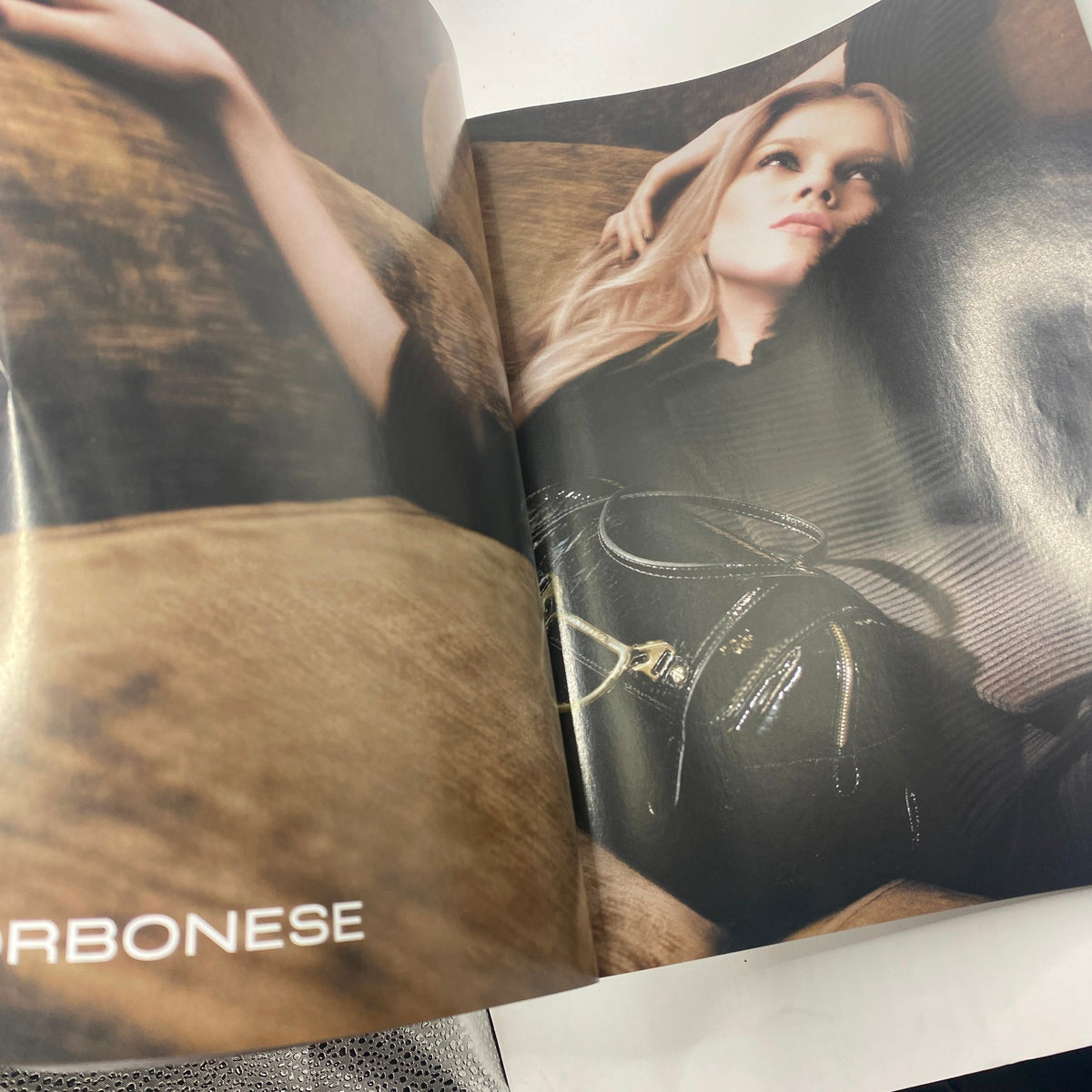 Interior page from Numéro Magazine September 2008 No. 96 featuring a model reclining on a couch, showcasing high fashion elements and editorial photography.