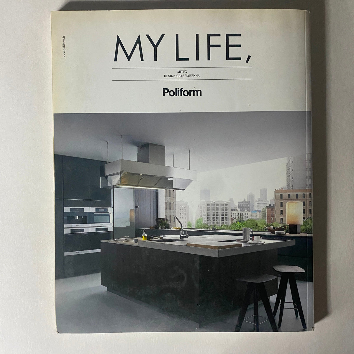 Cover of the Elle Decor Italia Magazine featuring the title 'My Life,' with a modern kitchen design by Poliform, highlighting contemporary interior aesthetics.