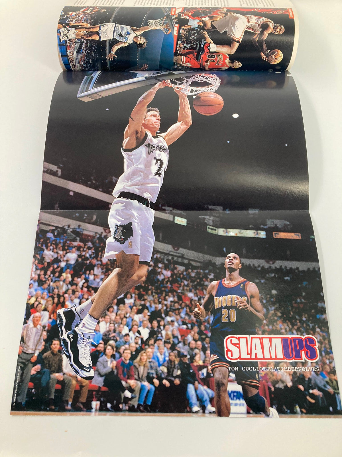 Slam Magazine October 1997 poster featuring a high-flying dunk by a player from the Minnesota Timberwolves, capturing the excitement of NBA action.