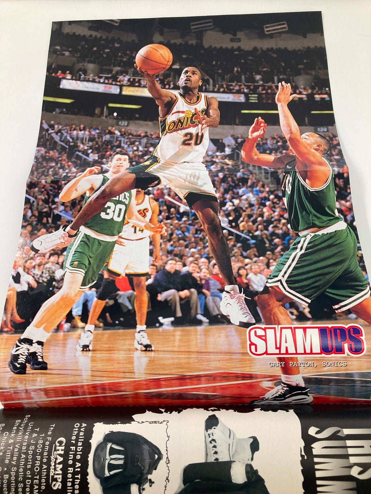 Slam Magazine October 1997 image of Gary Payton of the Seattle SuperSonics making a play, representing key moments in basketball history.
