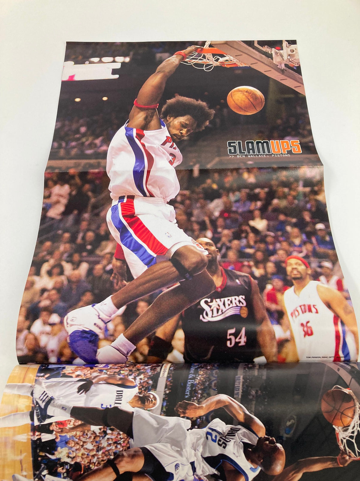 Vibrant poster of a basketball player making an impressive slam dunk, captured in Slam Magazine August 2005 Indiana Pacers Ron Artest w Poster No Label.