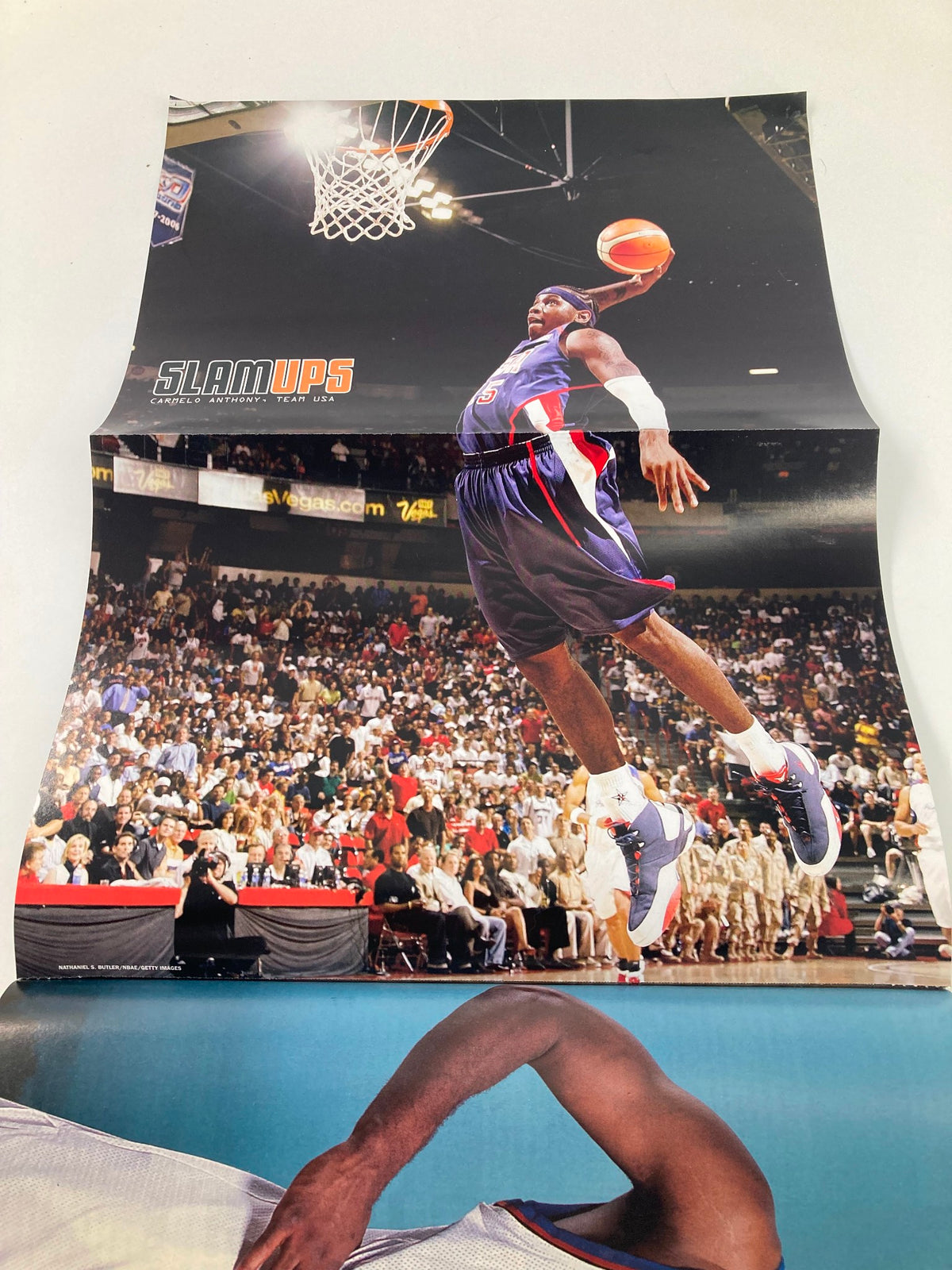 Slam Magazine November 2006 poster showcasing a dramatic basketball dunk, celebrating the excitement of the NBA, included with the magazine featuring Gilbert Arenas.
