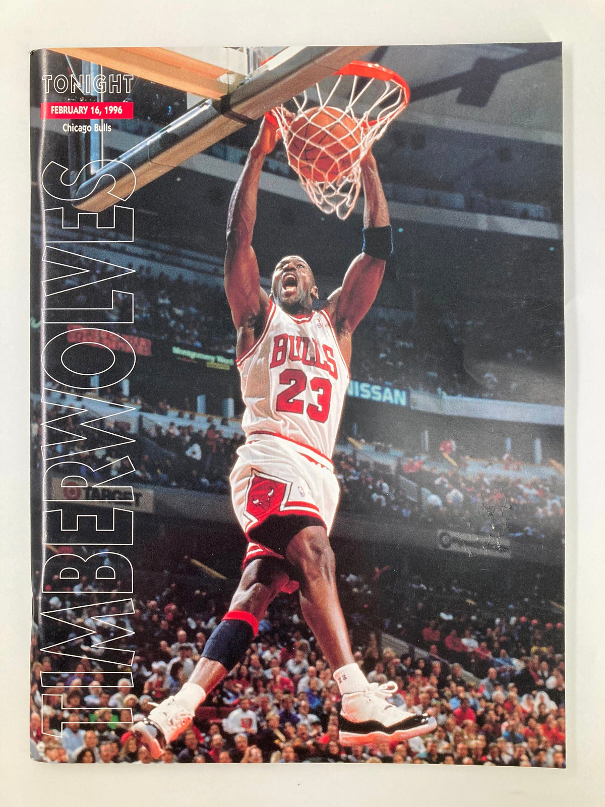 Timberwolves Tonight Magazine February 16, 1996 featuring Michael Jordan of the Chicago Bulls performing a slam dunk, showcasing a significant moment in basketball history.