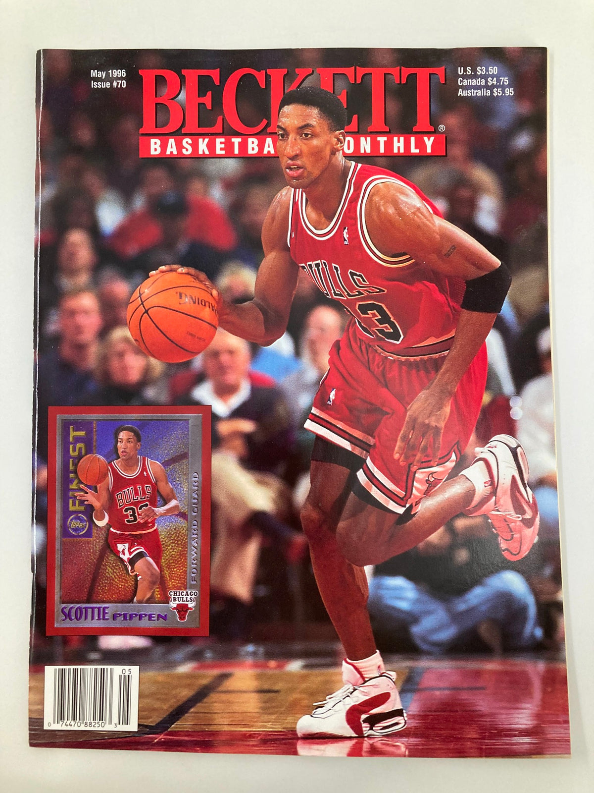 Beckett Monthly Magazine May 1996 #70 featuring NBA superstar Scottie Pippen on the cover, showcasing him in a Chicago Bulls uniform with a basketball. Ideal for collectors of vintage sports memorabilia.