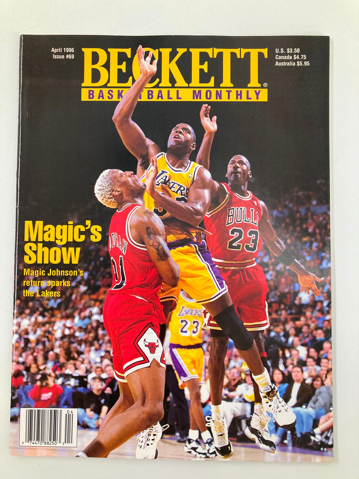 Beckett Monthly Magazine April 1996 Issue #69 featuring Michael Jordan and Magic Johnson on the cover, showcasing iconic basketball moments and highlighting Magic Johnson's return to the Lakers.