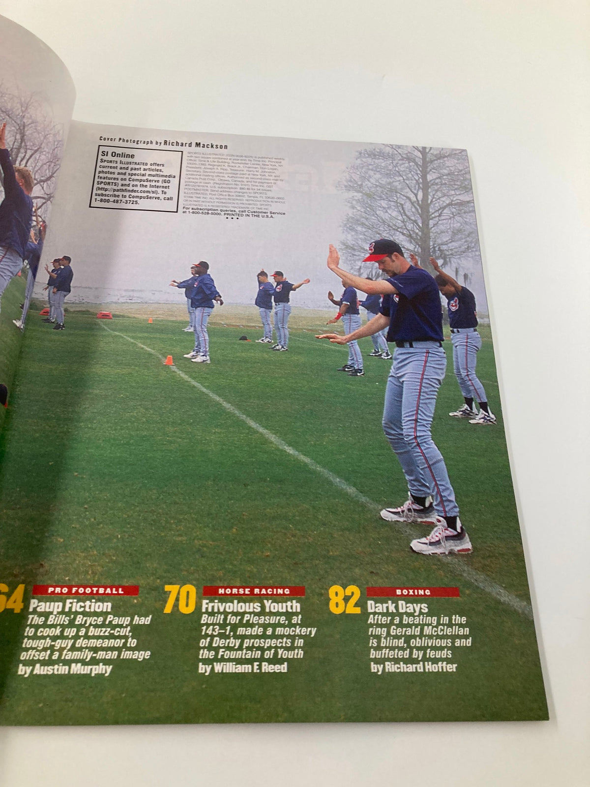 Image from Sports Illustrated Magazine March 4 1996, showcasing players engaged in training drills on a field, emphasizing the athletic spirit of the NBA era and capturing the nostalgic essence of basketball's vibrant history.