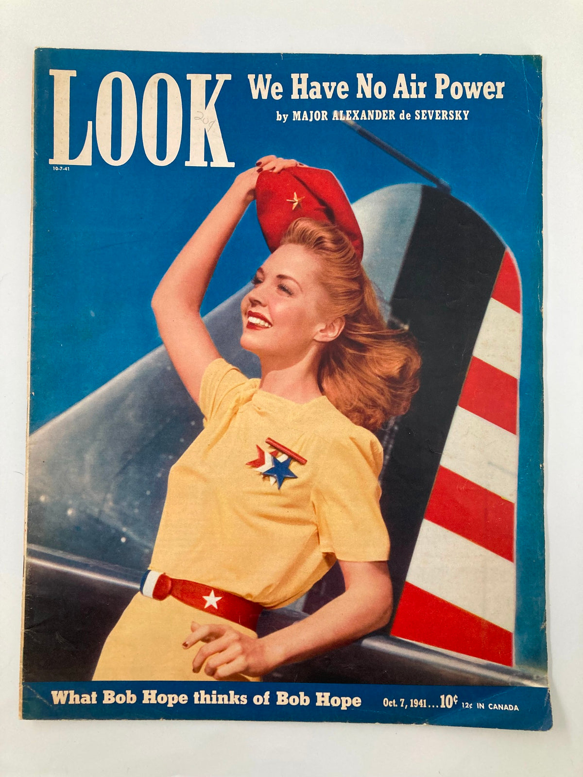 VTG Look Magazine October 7 1941 cover featuring a smiling woman in a yellow outfit and red hat next to an AT-6A Combat Plane.