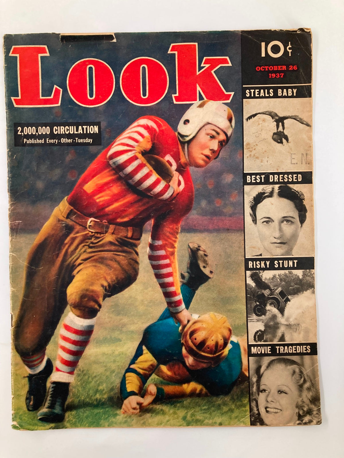 Cover of VTG Look Magazine October 26 1937 featuring a football player in a striped jersey, highlighting the main stories 'Steals Baby', 'Best Dressed', 'Risky Stunt', and 'Movie Tragedies'.
