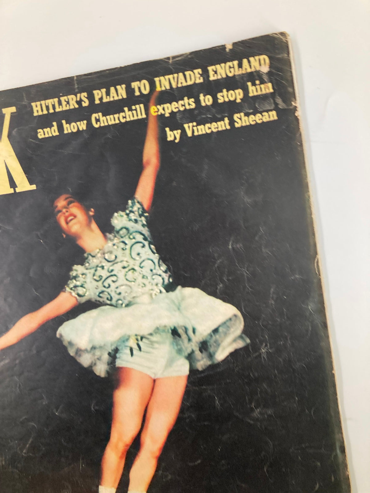 Detailed view of the title and cover story on Vintage Look Magazine March 11, 1941, focusing on 'Hitler's Plan to Invade England' and featuring a figure skater.
