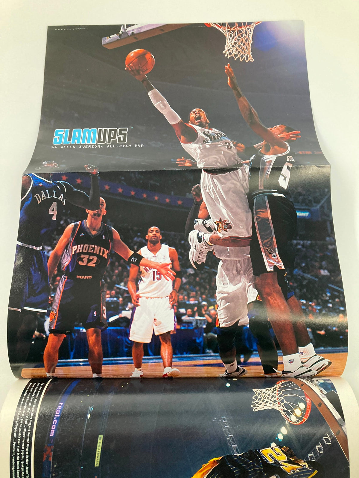 Fold-out poster page from Slam Magazine May 2001, capturing a powerful basketball dunk scene during an NBA game.
