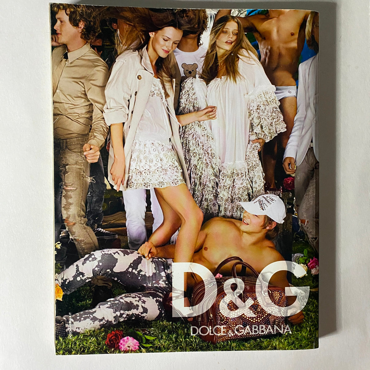 Numéro Magazine March 2008 No. 91 Suvi Koponen Cover featuring a stylish group of models in a fashion photo shoot, showcasing D&G Dolce & Gabbana designs against a vibrant floral background.