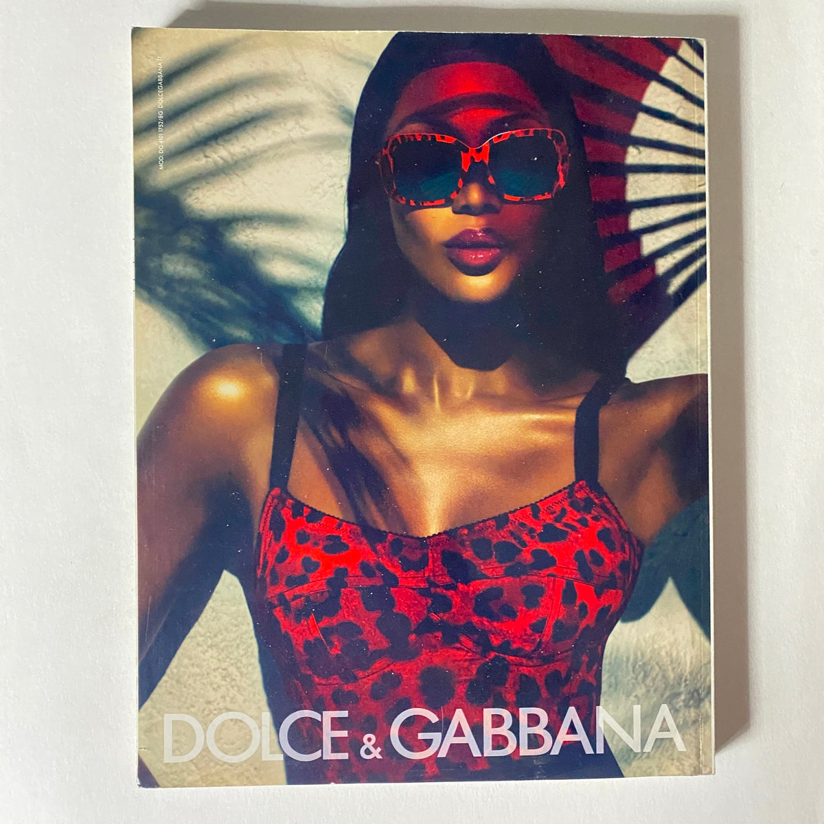 Numéro Magazine March 2011 cover with a striking image of a model wearing Dolce & Gabbana sunglasses and a bold red leopard print outfit.