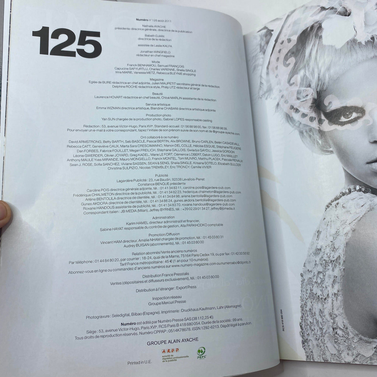 Inside view of Numéro Magazine August 2011 No. 125 featuring model details and editorial content.