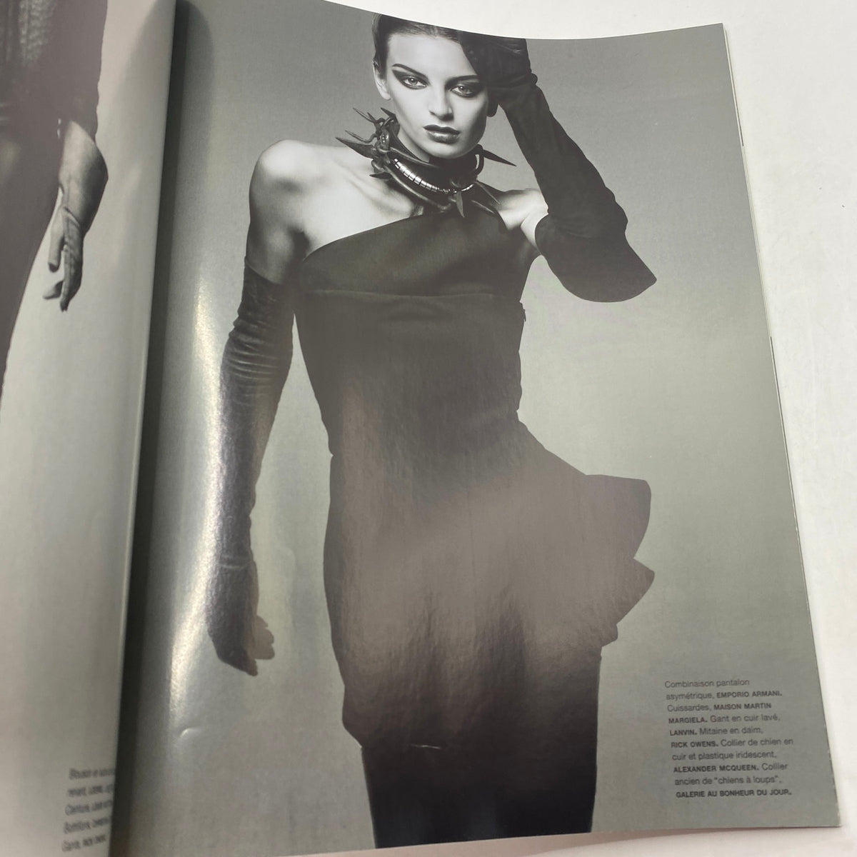 Fashion editorial spread from Numéro Magazine August 2011 No. 125 showcasing a model in a dramatic black outfit.
