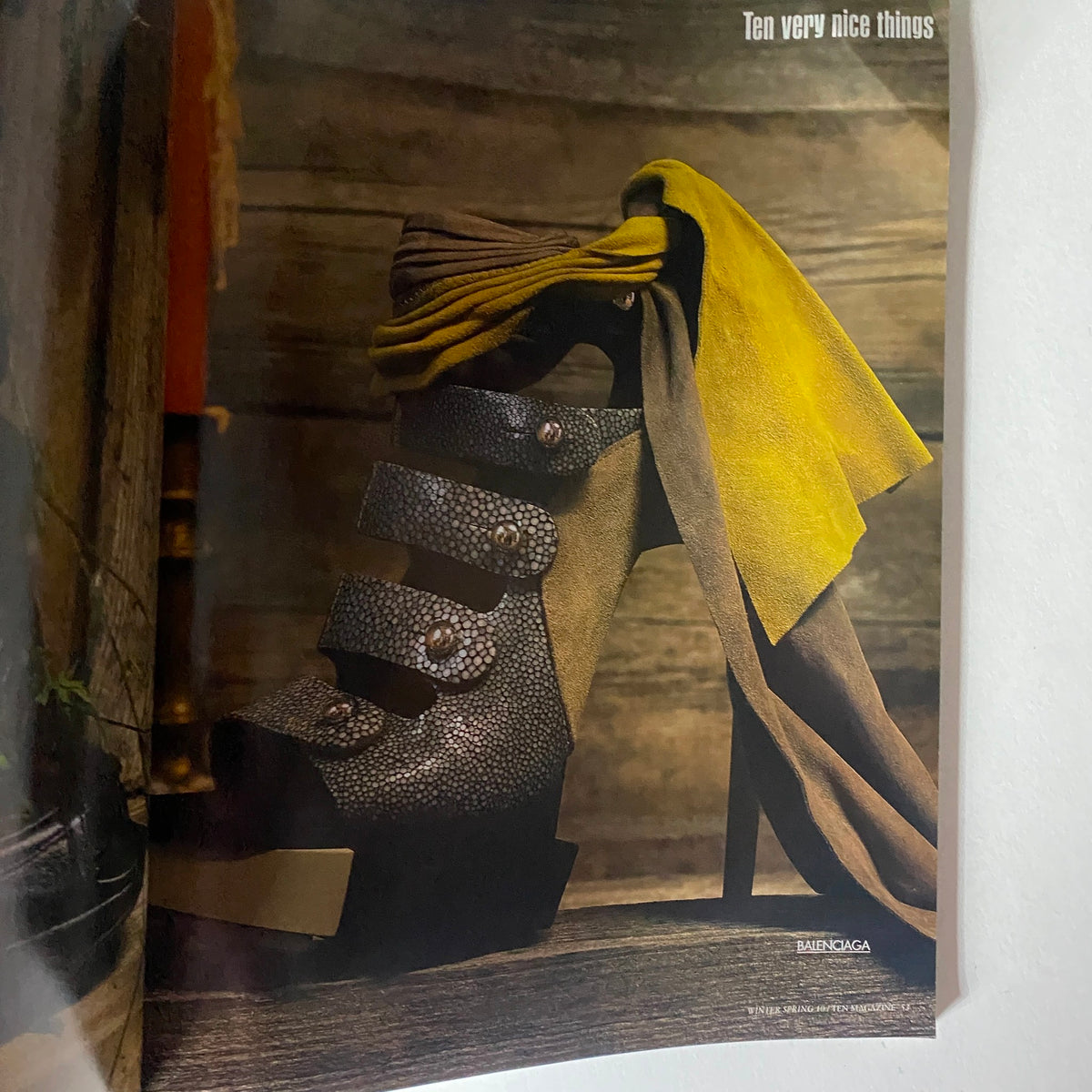 10 Magazine Winter 2009 featuring a striking high-heeled shoe adorned with unique textures and an elegant scarf design, showcasing fashion innovation by Jessica Craig-Martin.