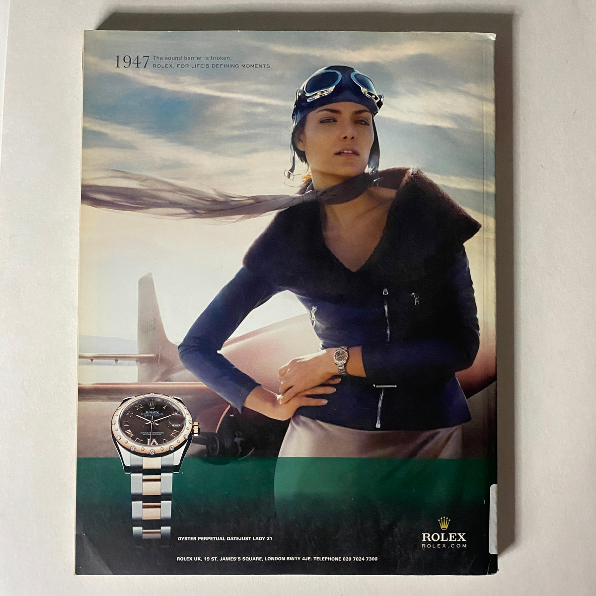A retro advertisement featuring a woman in a stylish outfit with a watch, promoting Rolex, associated with the i-D Magazine Spring - Summer 2011 Ajak Deng by Emma Summerton No Label VG.