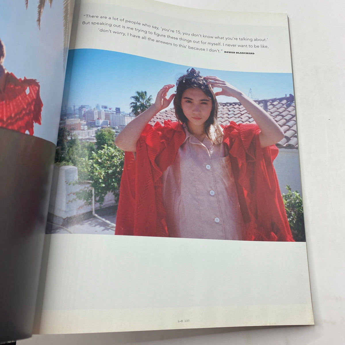 Another inside page from i-D Magazine Winter 2016 No. 346, featuring a model in a red garment with a scenic background, conveying contemporary fashion themes.