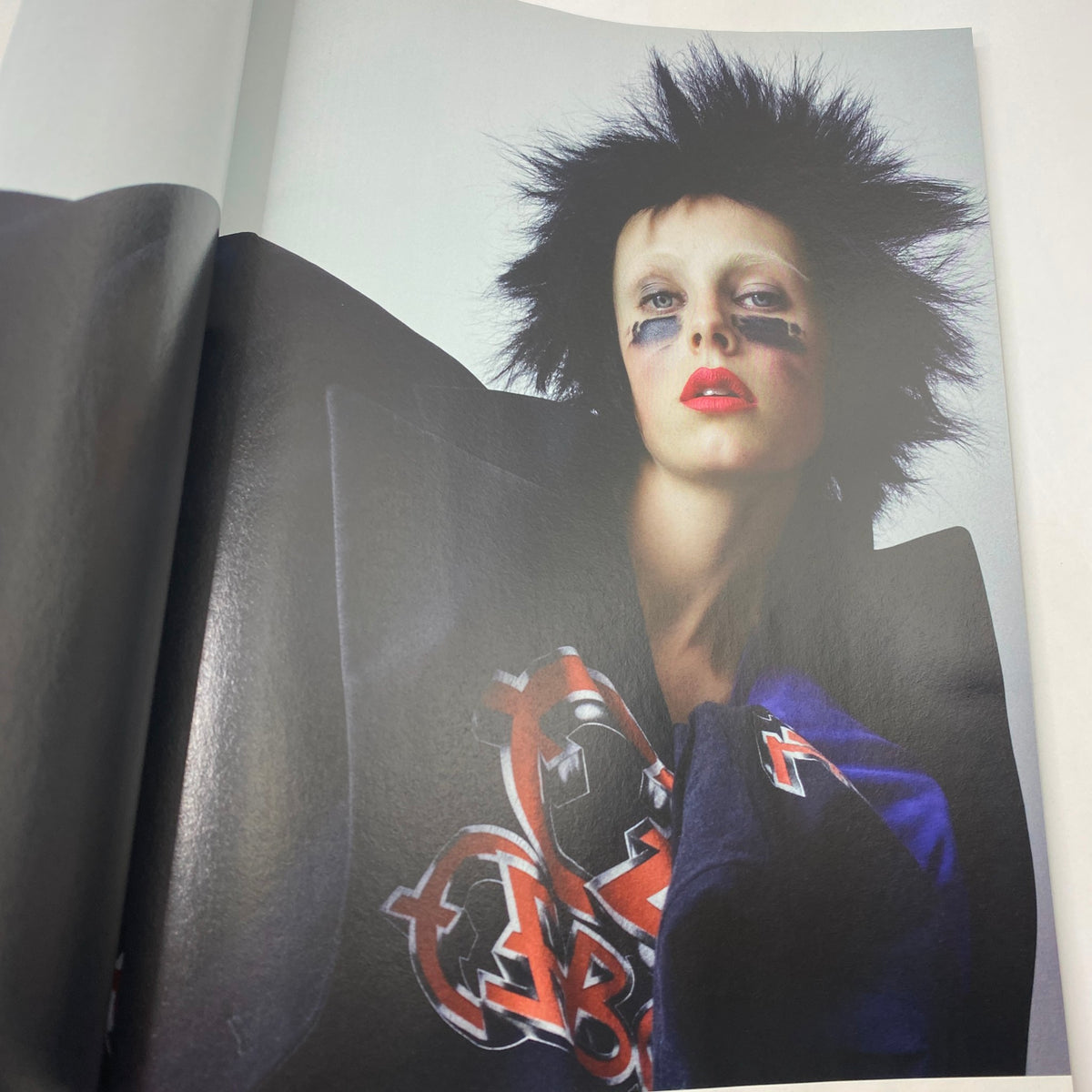 Fashion editorial spread from i-D Magazine Summer 2017 featuring a model with striking makeup and edgy hairstyle, embodying contemporary fashion trends.