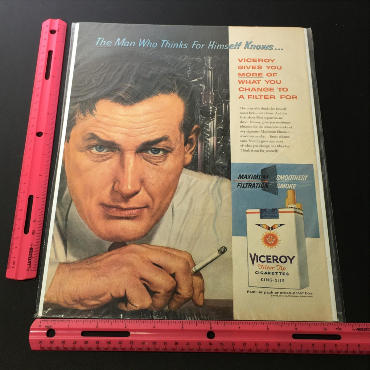 Side view of the vintage 1938 print ad for Viceroy King-Size Cigarettes with a ruler for scale, highlighting the ad design and details.