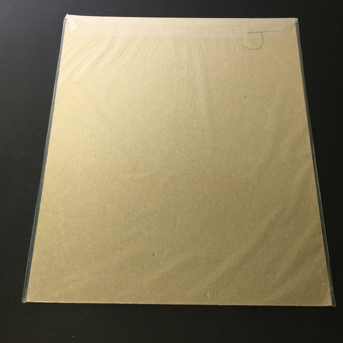 Back view of a vintage 1957 Chesterfield King Size Cigarette Print Ad, showing the protective covering and backing, ideal for collectors and enthusiasts of mid-century advertising memorabilia.