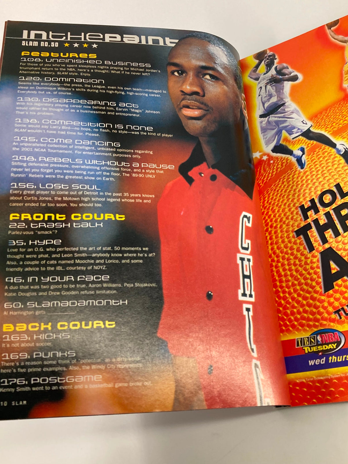 Inside spread of Slam Magazine April 2001 showcasing Michael Jordan in a striking pose, emphasizing his career and impact on basketball culture.
