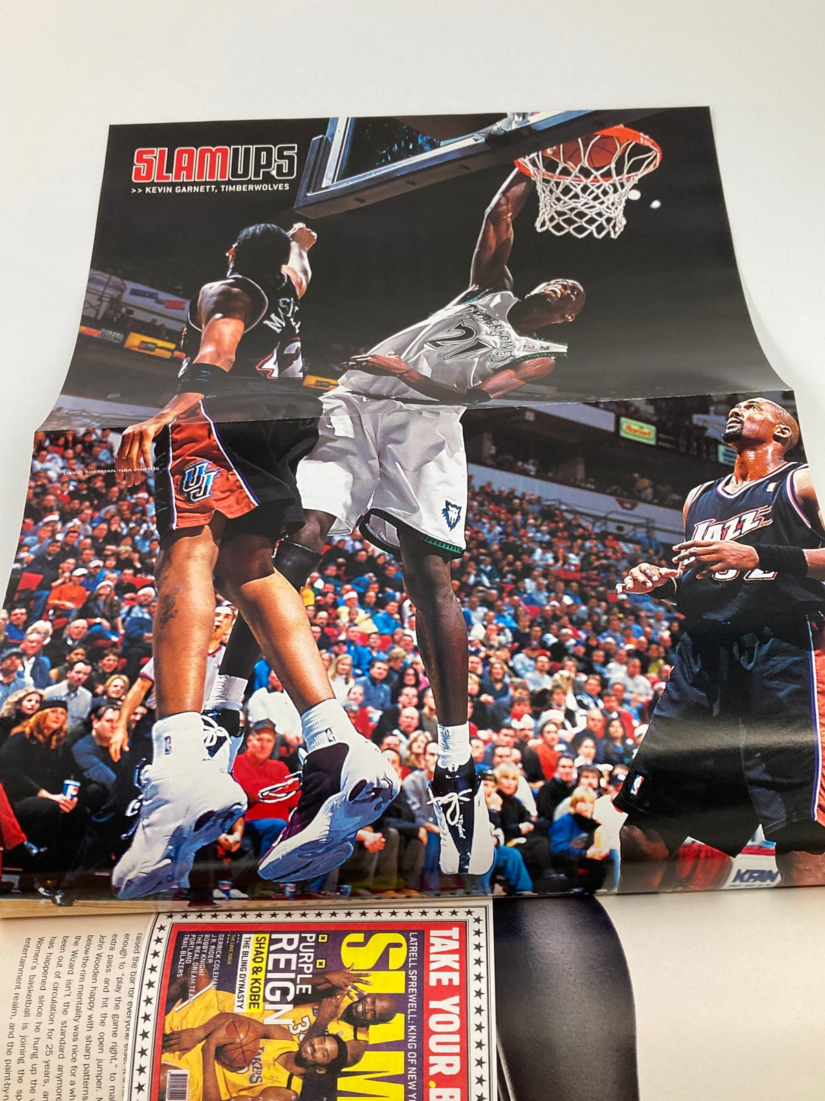 Fold-out poster from Slam Magazine April 2001 displaying an action shot of Kevin Garnett during a game, part of a collectible edition celebrating NBA highlights.