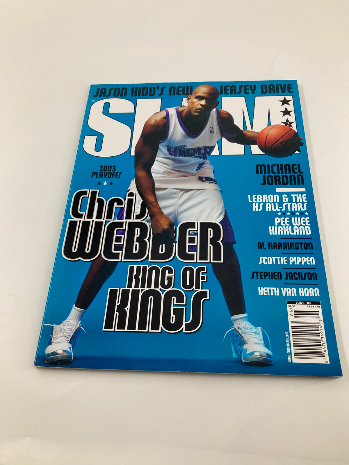 Slam Magazine June 2003 showcasing Chris Webber, King of Kings, with a focus on the magazine's cover design in bright blue during the 2003 NBA Playoffs.