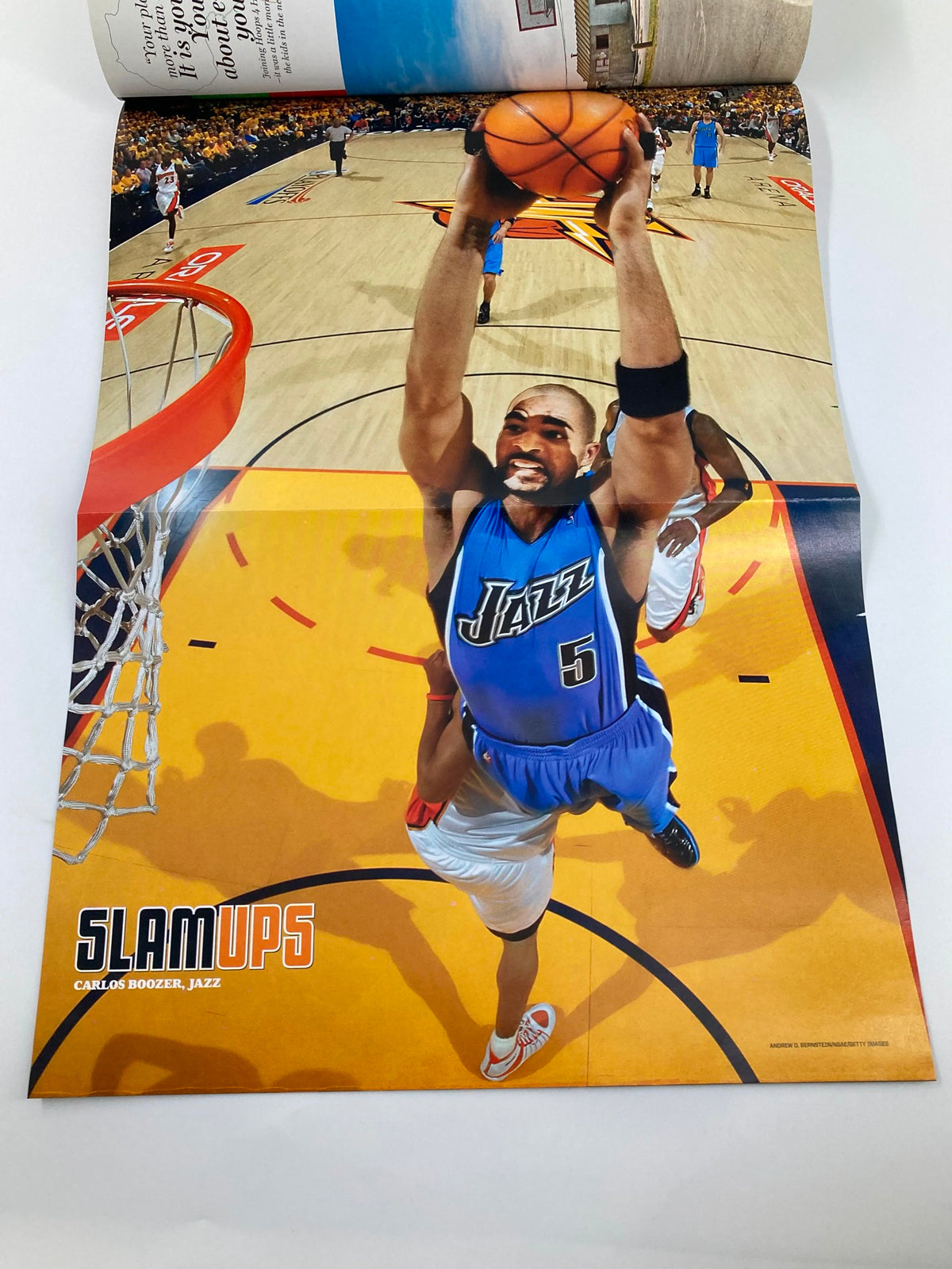 Slam Magazine August 2007 NBA featuring Carlos Boozer dunking during a game, part of the collectible poster included in the issue.