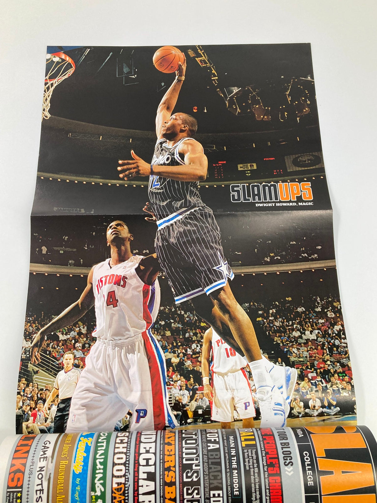Poster from Slam Magazine June 2007 displaying an athlete executing a dramatic dunk during a game, capturing the excitement of NBA action.