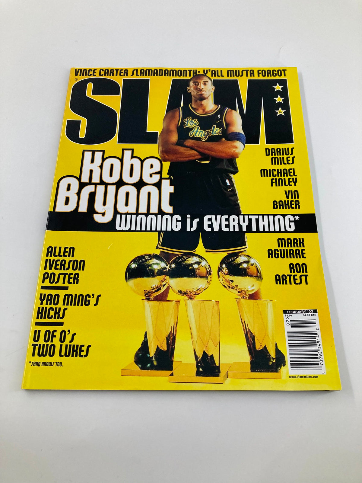Slam Magazine February 2003 featuring Kobe Bryant on the cover, showcasing his iconic presence with the Los Angeles Lakers, emphasizing the theme 'Winning is Everything'.