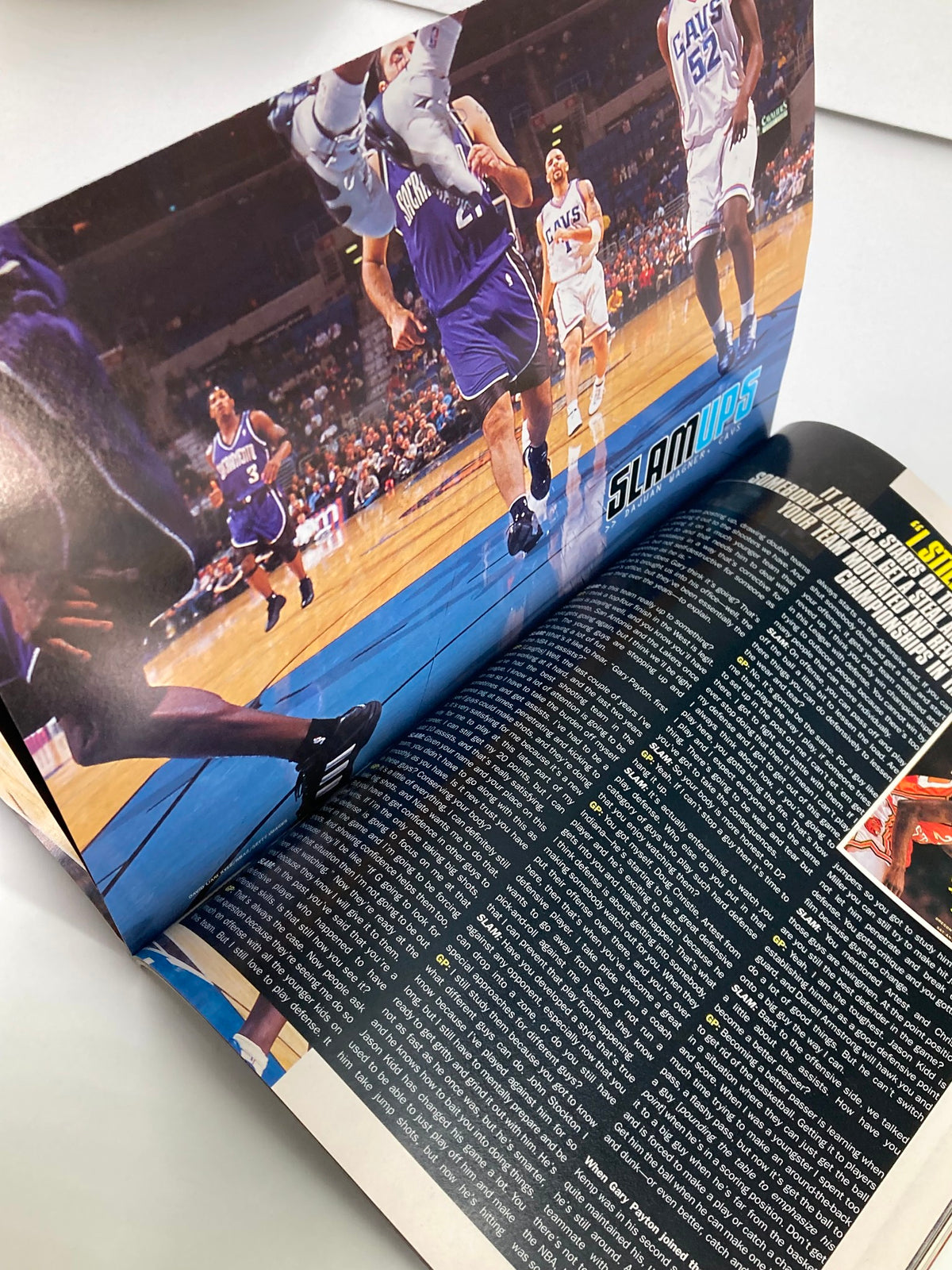Layout of an inside page from Slam Magazine March 2003, displaying action shots and articles covering the NBA season and players.