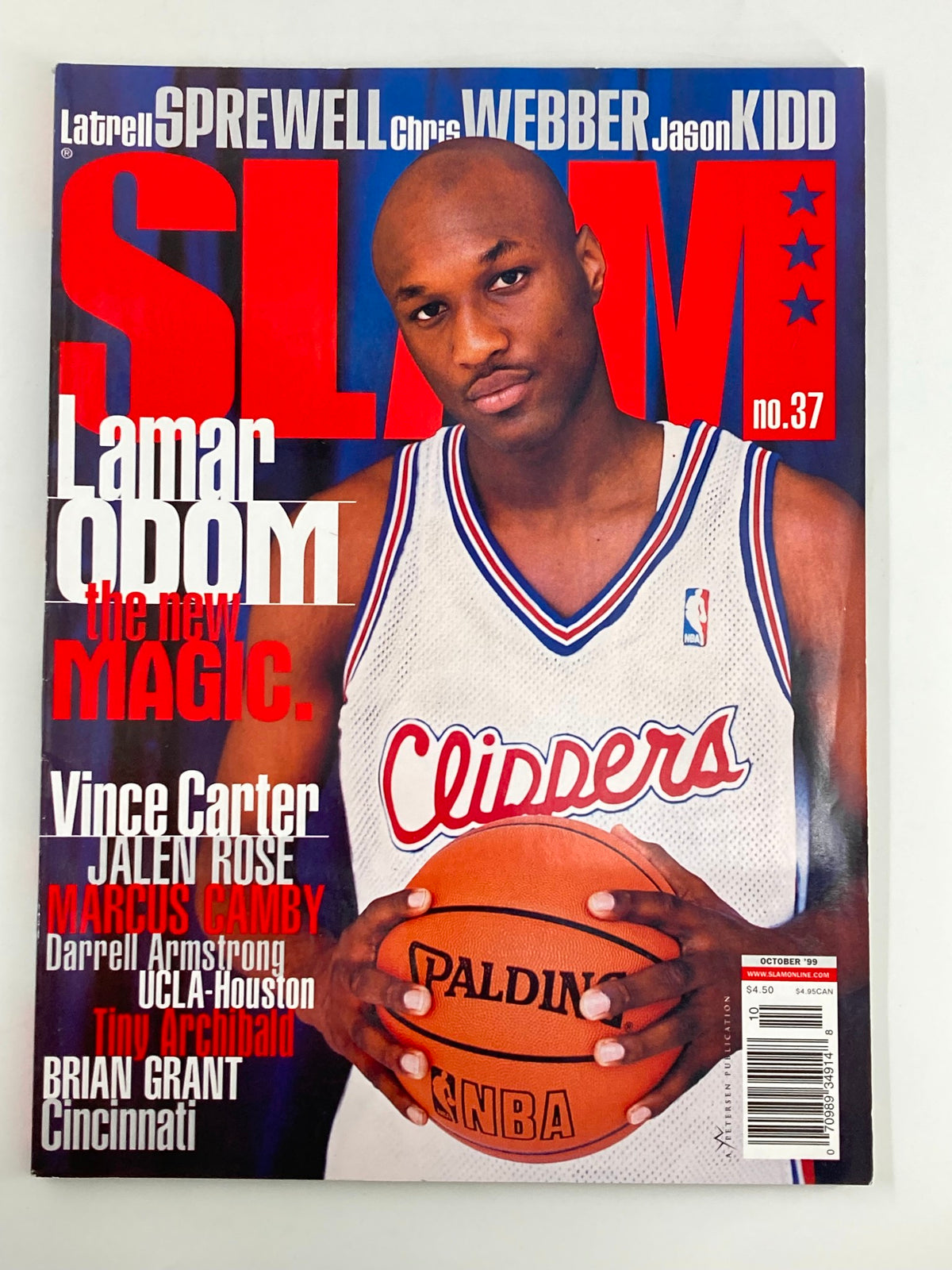 Slam Magazine October 1999 featuring Lamar Odom on the cover, showcasing his portrait while holding a basketball. The magazine highlights the Los Angeles Clippers and includes notable players like Vince Carter, Jalen Rose, and Marcus Camby.