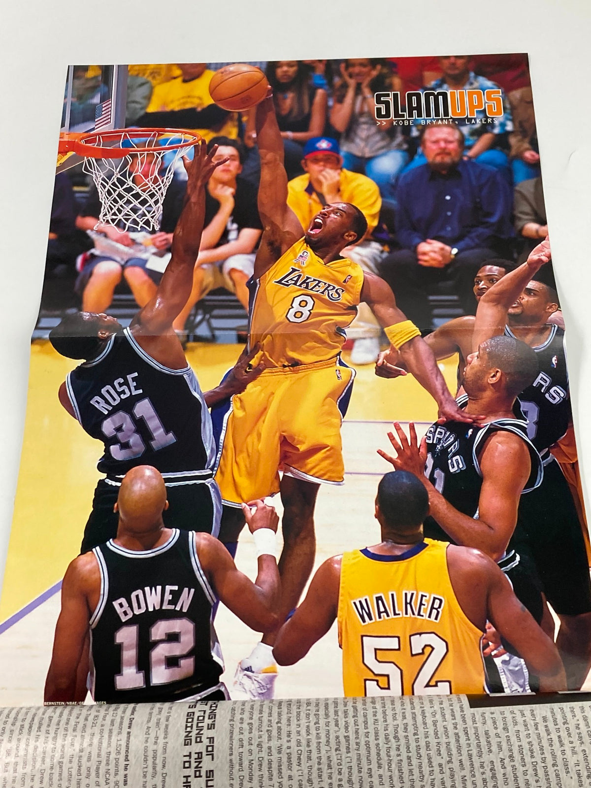 Collectible poster from Slam Magazine August 2002, featuring a dynamic basketball moment with Kobe Bryant, perfect for framing.