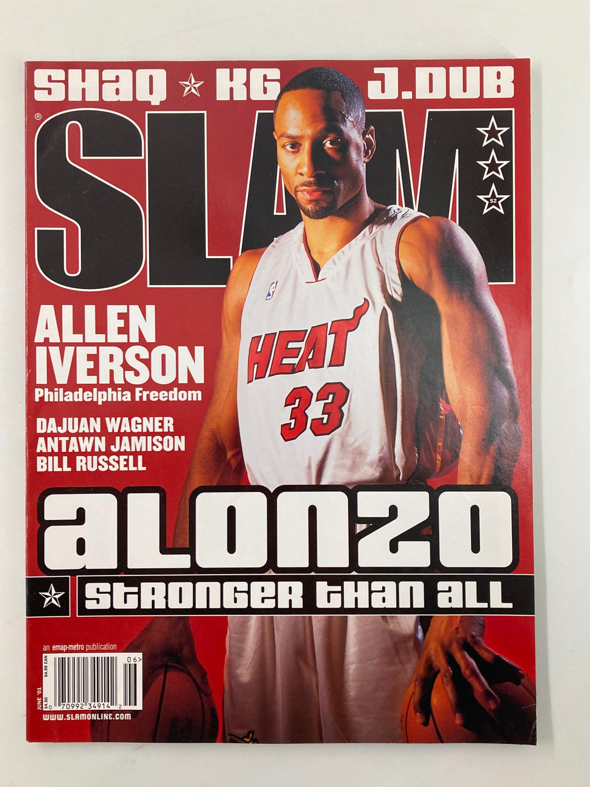 Slam Magazine June 2001 cover featuring NBA player Alonzo Mourning, showcasing his achievements with the Miami Heat, in a dynamic pose with a vibrant red background.