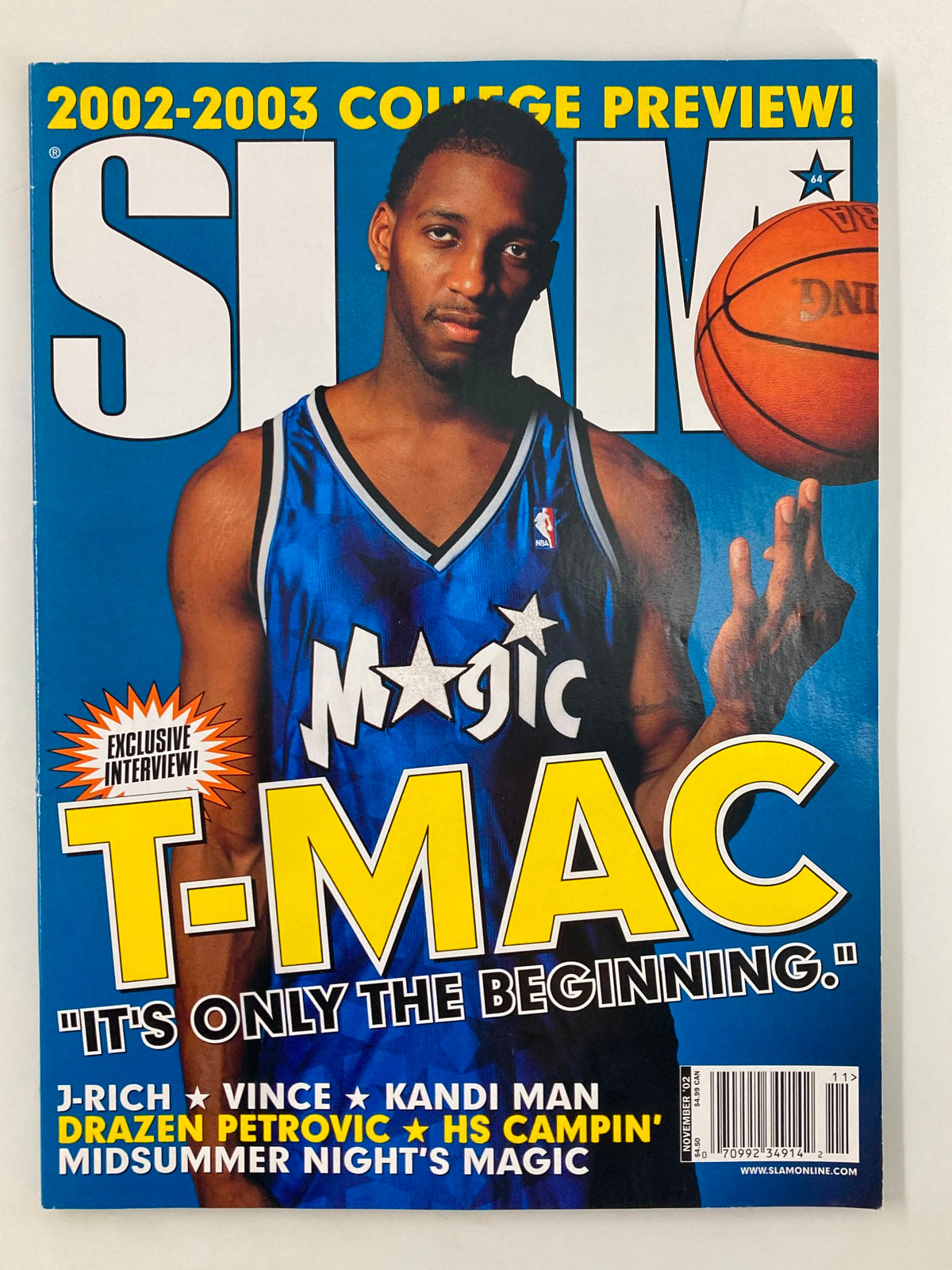 Slam Magazine November 2002 issue featuring Orlando Magic player Tracy McGrady on the cover, showcasing basketball nostalgia and a pivotal moment in NBA history.