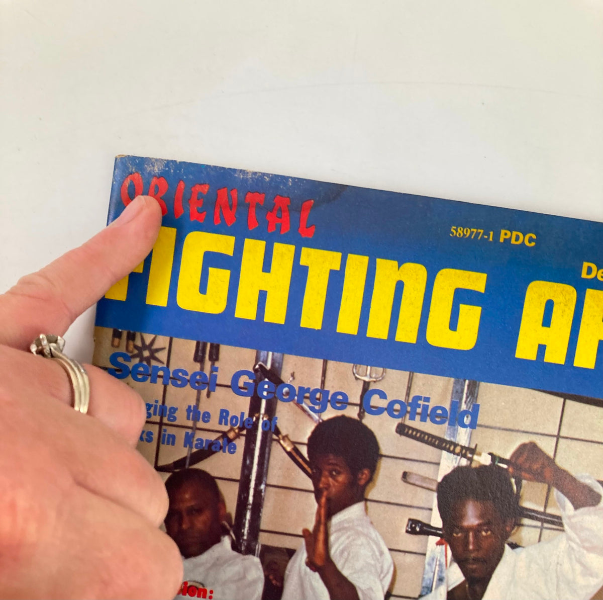 Close-up image of VTG Oriental Fighting Arts Magazine December 1974, highlighting the title and specific articles on martial arts, including Chuck Merriman and George Cofield.