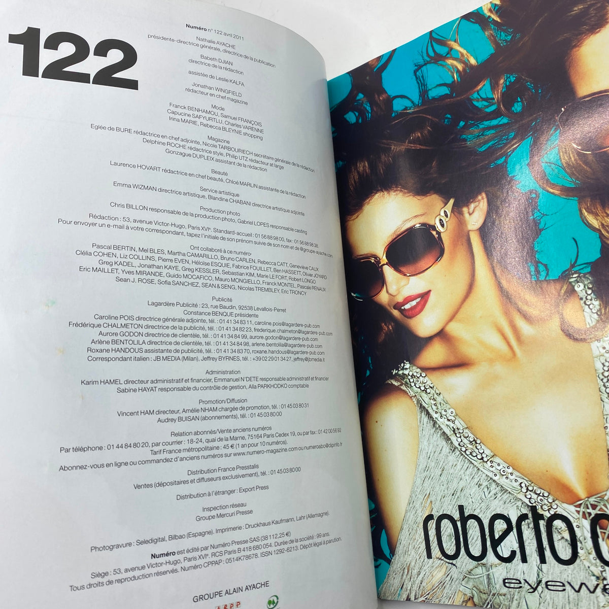 Inside page of Numéro Magazine April 2011 #122, displaying magazine details and advertisements, featuring vibrant imagery and design elements.