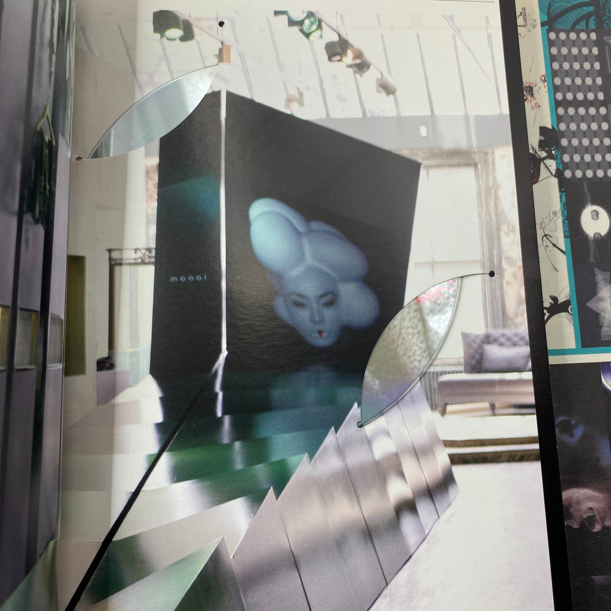 Page from IdN Magazine 2008/2009 Vol 15 No. 6 showcasing a contemporary art installation with a unique sculptural face, reflecting innovative design and aesthetics in retail environments.