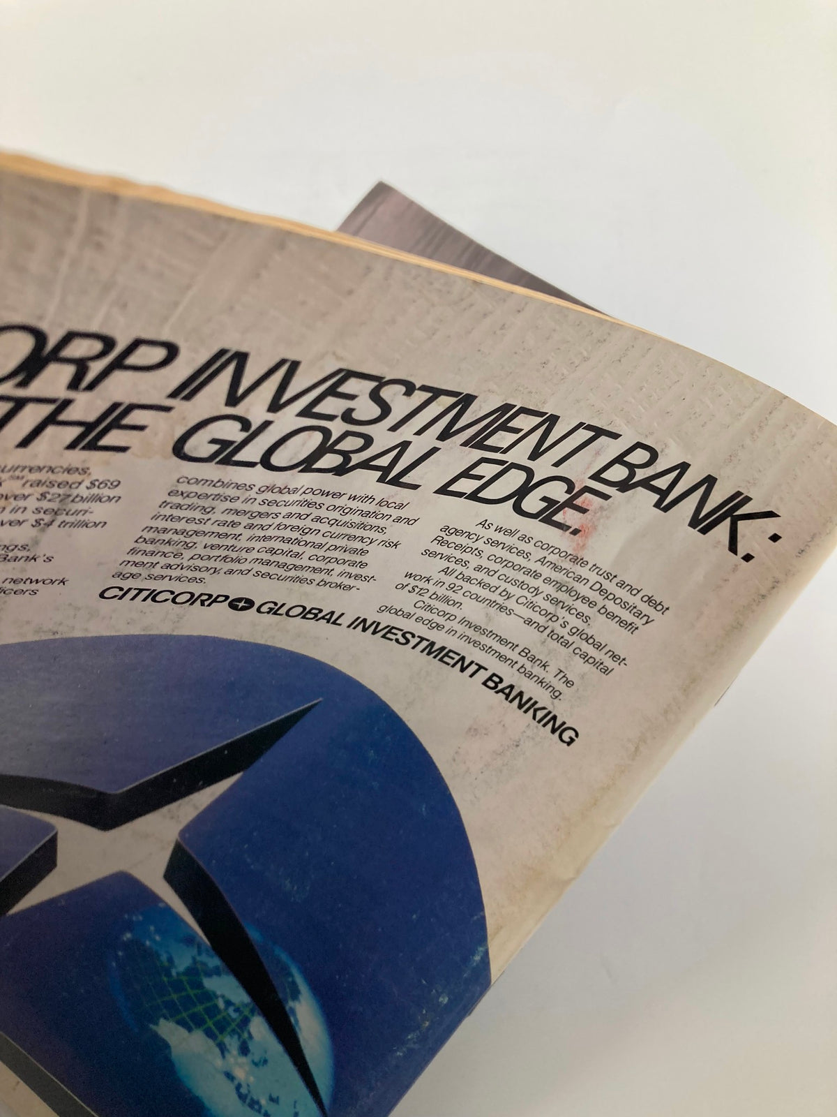 Close-up view of an article titled 'Citicorp Investment Bank: The Global Edge' from Forbes Magazine July 1, 1985, emphasizing global investment banking strategies.
