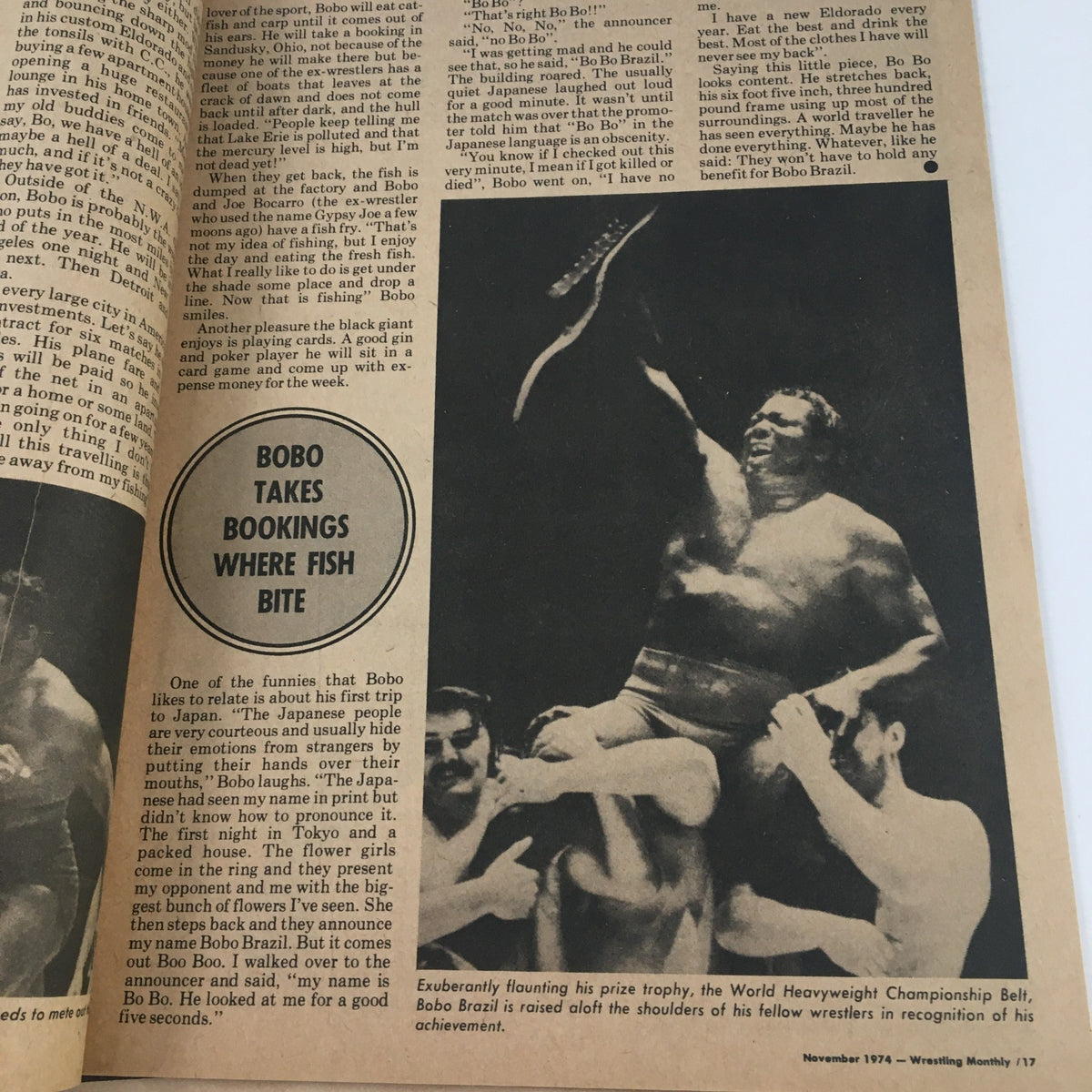 Wrestling Monthly Magazine November 1974 featuring Bobo Brazil flaunting the World Heavyweight Championship Belt, exuding pride and achievement alongside fellow wrestlers.