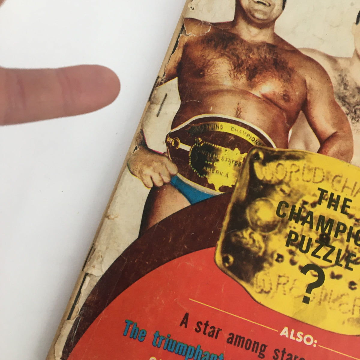 Close-up of the Wrestling Monthly Magazine October 1971 cover showing Fred Blassie with the championship belt. The cover highlights wrestling topics including a champion puzzle and notable wrestlers of the era.