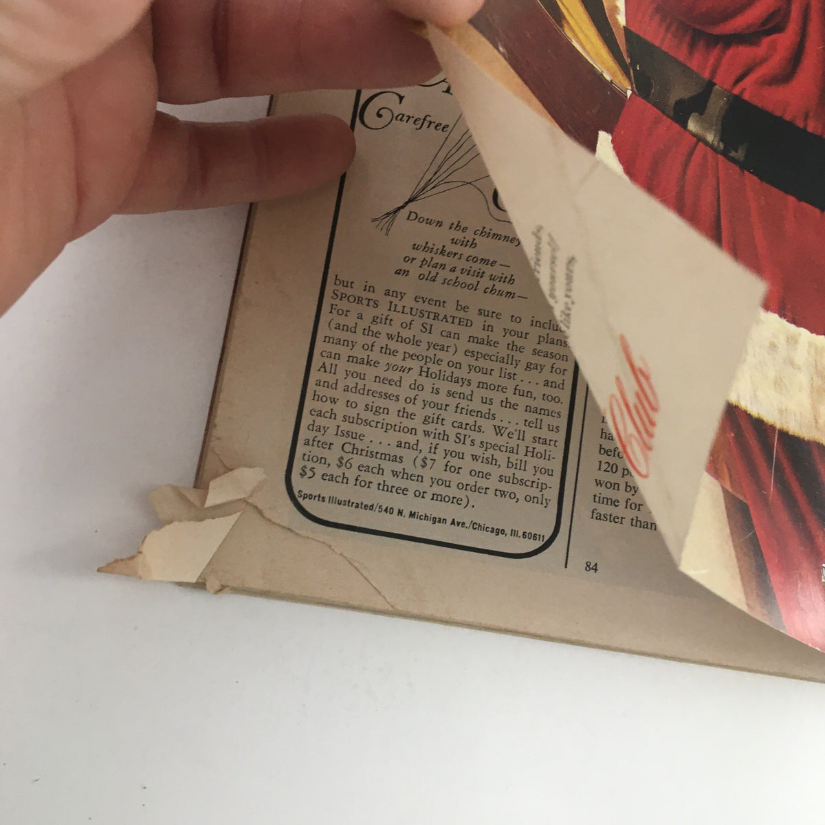 Back cover view of Sports Illustrated Magazine December 16 1963 showing minor damage with a torn corner, illustrating its vintage condition.