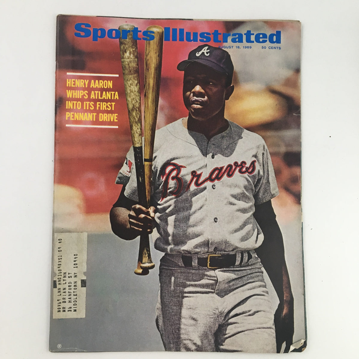 Sports Illustrated Magazine August 18 1969 cover featuring Henry Aaron, the legendary baseball player, holding two bats in full Braves uniform, highlighting his pivotal role in Atlanta's first pennant drive.