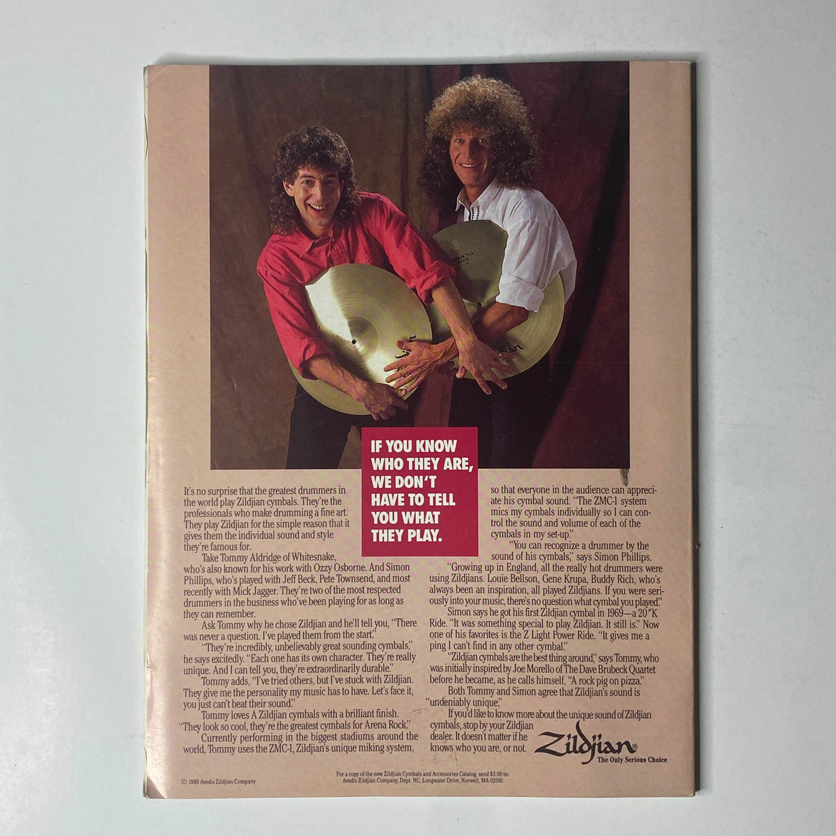Modern Drummer Magazine January 1989 Al Foster Cover - Image depicting two drummers, one holding a Zildjian cymbal, discussing the significance of drum brands, reflecting the magazine's focus on drumming and musical collaboration.