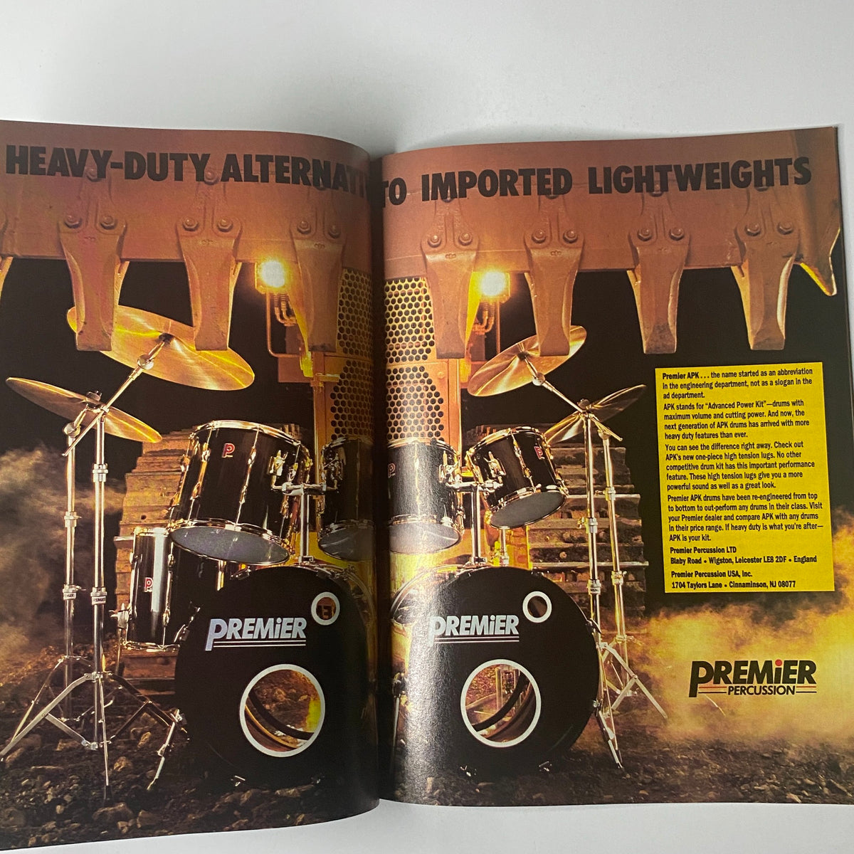 Premier Percussion advertisement featuring a heavy-duty drum set setup, showcased in Modern Drummer Magazine August 1988 with Joey Kramer on the cover. The image emphasizes robust drumming gear alternatives, conveying a dynamic atmosphere for drummers.