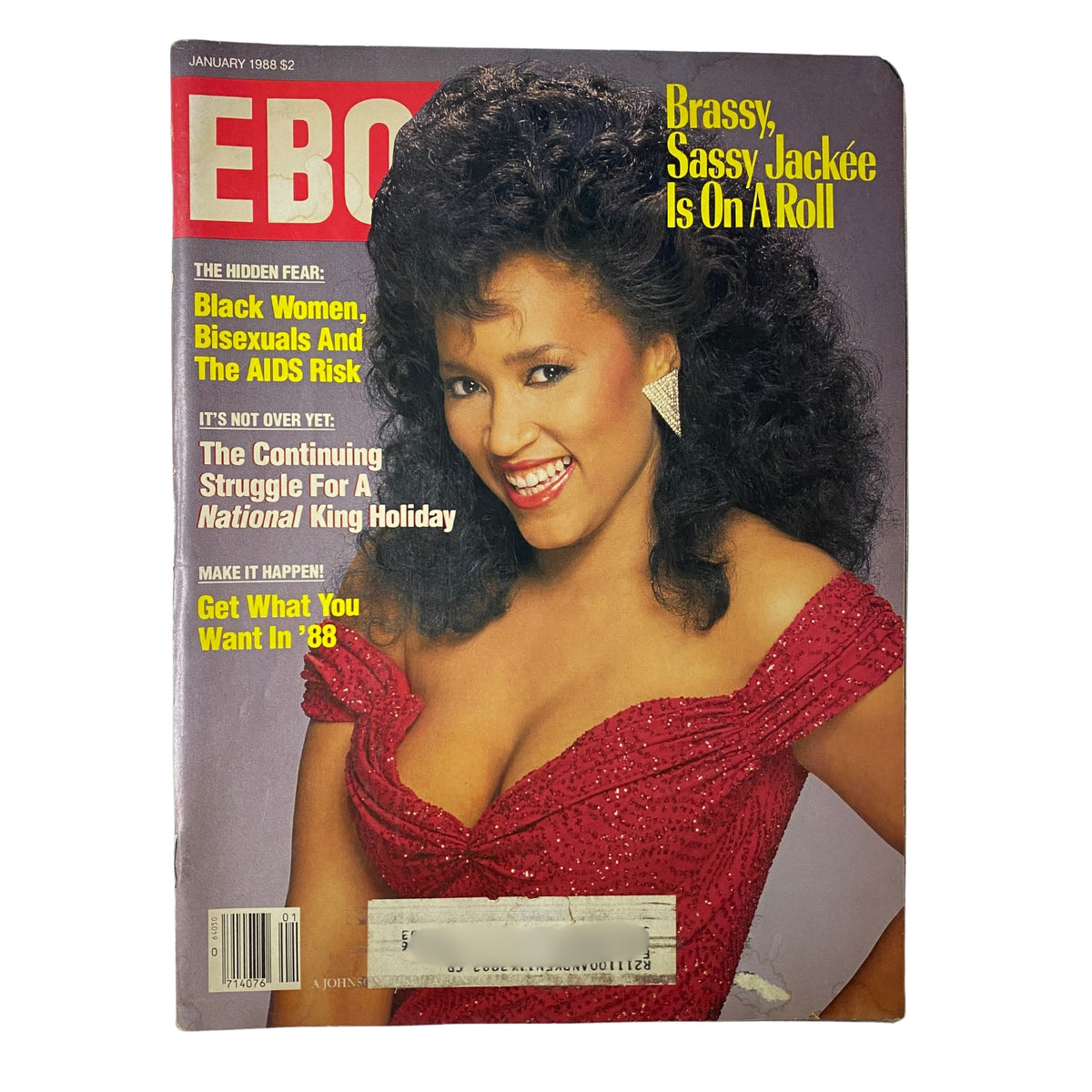 Ebony Magazine January 1988 cover featuring Jackée Harry, showcasing her vibrant personality in a striking red dress with curly hair, highlighting her status as a beloved television star.