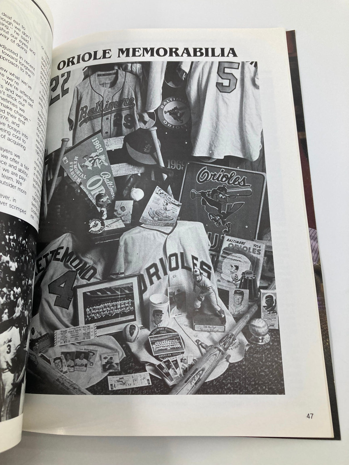 1983 MLB Baltimore Orioles World Champions 30th Anniversary Official Yearbook featuring memorabilia including jerseys and souvenirs related to the Baltimore Orioles.