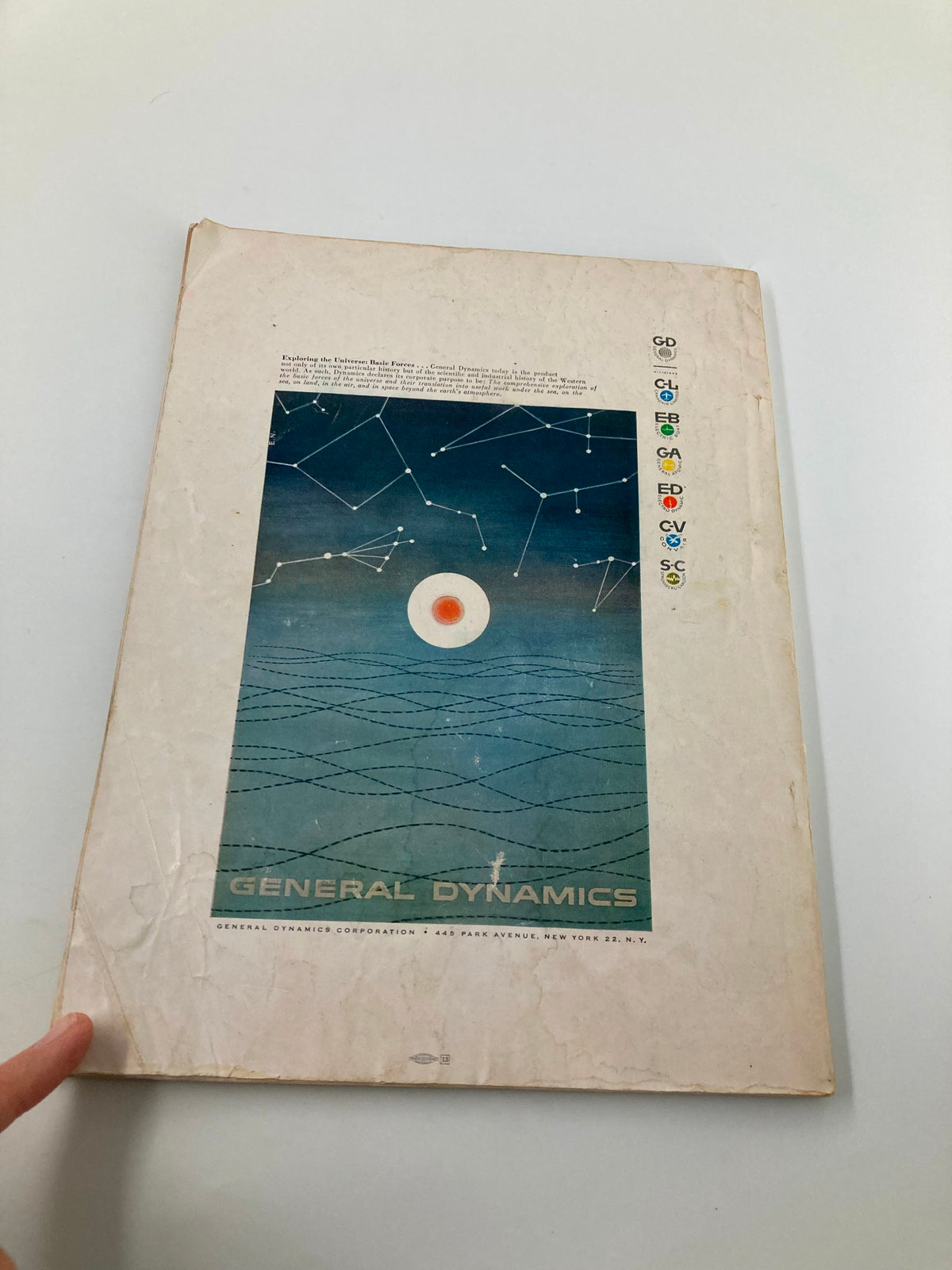 1940 NCAA Football Army vs Navy Official Program showcasing the back cover design, featuring a cosmic theme from General Dynamics with a stylized illustration.